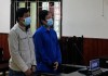 Hai bị cáo Đỗ Quang Hùng  và Phạm Hoàng Vị tại phiên tòa.